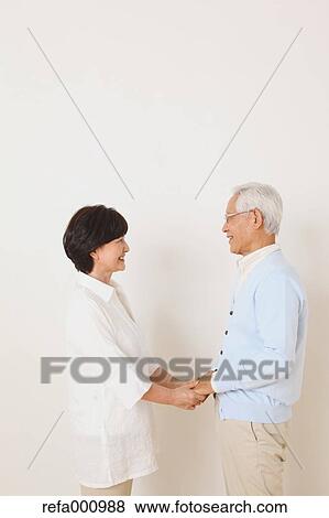 Senior adult Japanese couple against white wall View Large Photo Image Stock Photo - Senior adult Japanese couple against white wall. Fotosearch