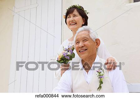 Senior adult Japanese couple celebrating View Large Photo Image Picture - Senior adult Japanese couple celebrating. Fotosearch