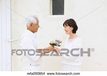 Senior adult Japanese couple celebrating View Large Photo Image Picture - Senior adult Japanese couple celebrating. Fotosearch