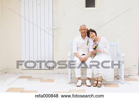 Senior adult Japanese couple celebrating View Large Photo Image Stock Photo - Senior adult Japanese couple celebrating. Fotosearch