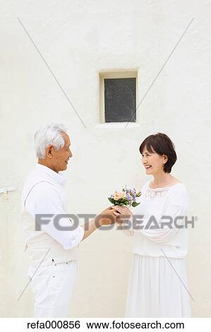 Senior adult Japanese couple celebrating View Large Photo Image Stock Photograph - Senior adult Japanese couple celebrating. Fotosearch