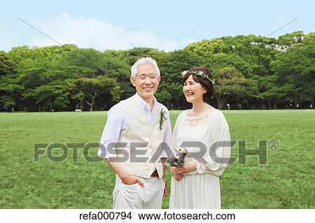 Senior adult Japanese couple in a park View Large Photo Image Picture - Senior adult Japanese couple in a park. Fotosearch