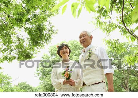 Senior adult Japanese couple in a park View Large Photo Image Picture - Senior adult Japanese couple in a park. Fotosearch