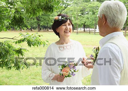 Senior adult Japanese couple in a park View Large Photo Image Picture - Senior adult Japanese couple in a park. Fotosearch