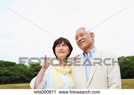 Senior adult Japanese couple in a park View Large Photo Image Stock Image - Senior adult Japanese couple in a park. Fotosearch