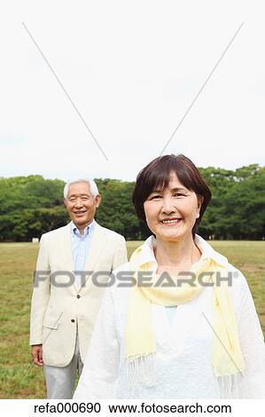 Senior adult Japanese couple in a park View Large Photo Image Stock Image - Senior adult Japanese couple in a park. Fotosearch