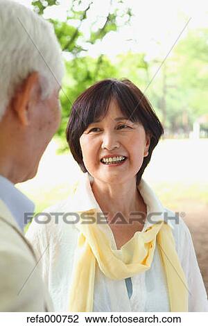 Senior adult Japanese couple in a park View Large Photo Image Stock Image - Senior adult Japanese couple in a park. Fotosearch