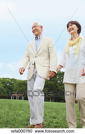 Senior adult Japanese couple in a park View Large Photo Image Stock Image - Senior adult Japanese couple in a park. Fotosearch