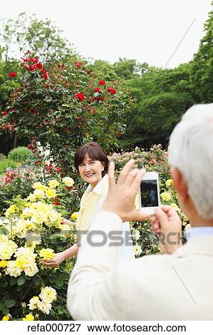 Senior adult Japanese couple in a park View Large Photo Image Stock Photo - Senior adult Japanese couple in a park. Fotosearch