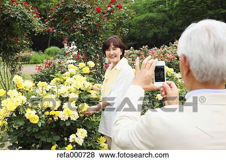 Senior adult Japanese couple in a park View Large Photo Image Stock Photo - Senior adult Japanese couple in a park. Fotosearch
