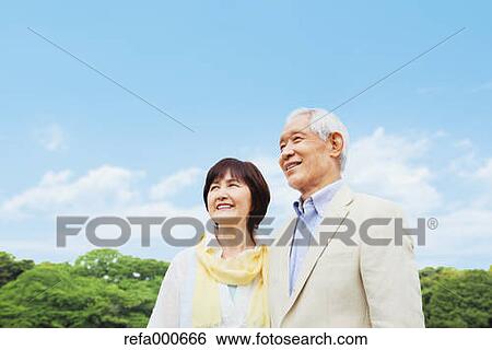 Senior adult Japanese couple in a park View Large Photo Image Stock Photograph - Senior adult Japanese couple in a park. Fotosearch