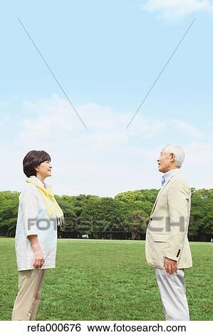 Stock Photograph - Senior adult Japanese couple in a park. Fotosearch