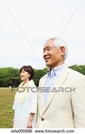 Senior adult Japanese couple in a park View Large Photo Image Stock Photograph - Senior adult Japanese couple in a park. Fotosearch