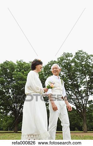 Senior adult Japanese couple in a park View Large Photo Image Stock Photograph - Senior adult Japanese couple in a park. Fotosearch