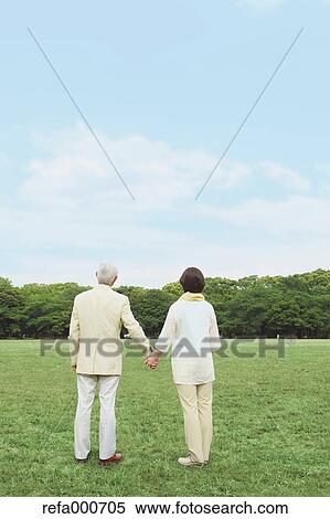 Stock Photography - Senior adult Japanese couple in a park. Fotosearch