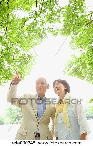 Senior adult Japanese couple in a park View Large Photo Image Stock Photography - Senior adult Japanese couple in a park. Fotosearch
