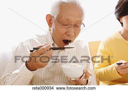 Senior adult Japanese couple in the kitchen View Large Photo Image Picture - Senior adult Japanese couple in the kitchen. Fotosearch