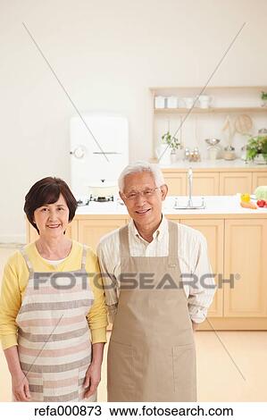 Senior adult Japanese couple in the kitchen View Large Photo Image Stock Image - Senior adult Japanese couple in the kitchen. Fotosearch