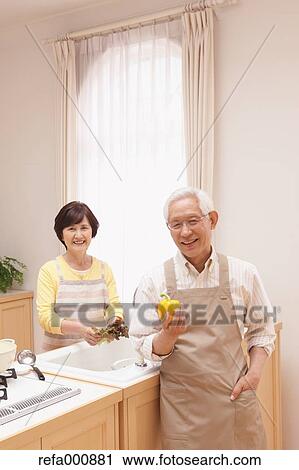Senior adult Japanese couple in the kitchen View Large Photo Image Stock Image - Senior adult Japanese couple in the kitchen. Fotosearch
