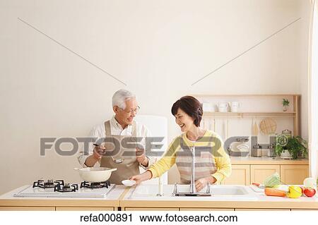 Senior adult Japanese couple in the kitchen View Large Photo Image Stock Image - Senior adult Japanese couple in the kitchen. Fotosearch