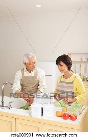 Senior adult Japanese couple in the kitchen View Large Photo Image Stock Image - Senior adult Japanese couple in the kitchen. Fotosearch