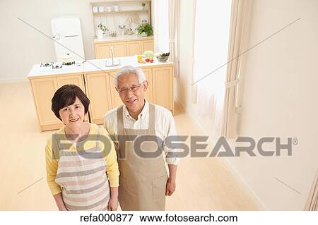 Senior adult Japanese couple in the kitchen View Large Photo Image Stock Photo - Senior adult Japanese couple in the kitchen. Fotosearch