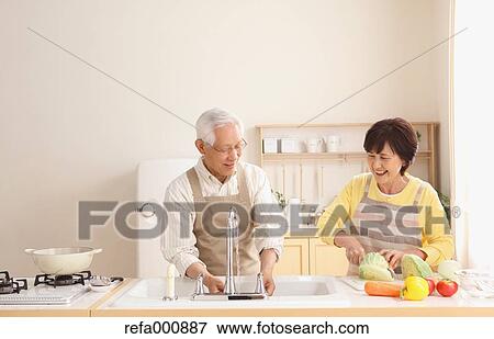 Senior adult Japanese couple in the kitchen View Large Photo Image Stock Photo - Senior adult Japanese couple in the kitchen. Fotosearch