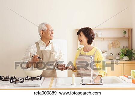 Senior adult Japanese couple in the kitchen View Large Photo Image Stock Photo - Senior adult Japanese couple in the kitchen. Fotosearch