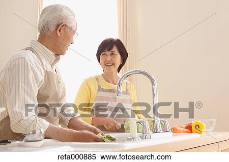 Senior adult Japanese couple in the kitchen View Large Photo Image Stock Photography - Senior adult Japanese couple in the kitchen. Fotosearch