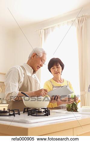 Senior adult Japanese couple in the kitchen View Large Photo Image Stock Photography - Senior adult Japanese couple in the kitchen. Fotosearch