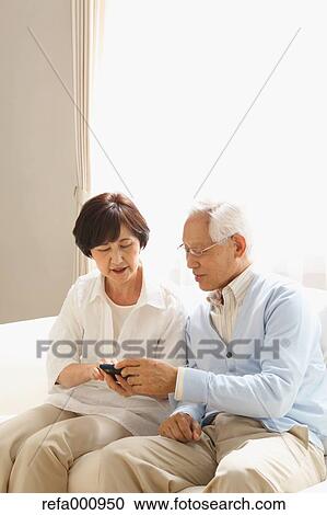 Senior adult Japanese couple on the sofa View Large Photo Image Stock Image - Senior adult Japanese couple on the sofa. Fotosearch