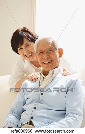 Senior adult Japanese couple on the sofa View Large Photo Image Stock Photograph - Senior adult Japanese couple on the sofa. Fotosearch