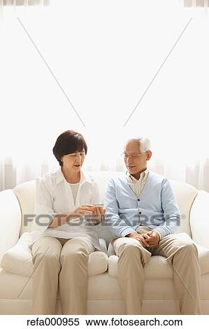Senior adult Japanese couple on the sofa View Large Photo Image Stock Photography - Senior adult Japanese couple on the sofa. Fotosearch