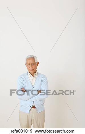 Senior adult Japanese man against white wall View Large Photo Image Stock Photo - Senior adult Japanese man against white wall. Fotosearch