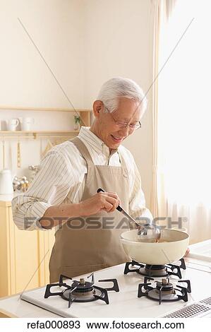 Senior adult Japanese man cooking View Large Photo Image Stock Image - Senior adult Japanese man cooking. Fotosearch