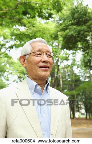 Senior adult Japanese man in a park View Large Photo Image Picture - Senior adult Japanese man in a park. Fotosearch