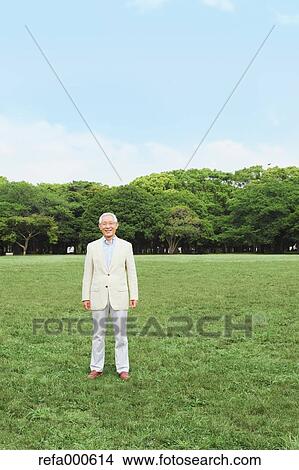 Senior adult Japanese man in a park View Large Photo Image Picture - Senior adult Japanese man in a park. Fotosearch