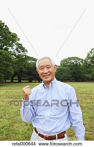 Senior adult Japanese man in a park View Large Photo Image Picture - Senior adult Japanese man in a park. Fotosearch
