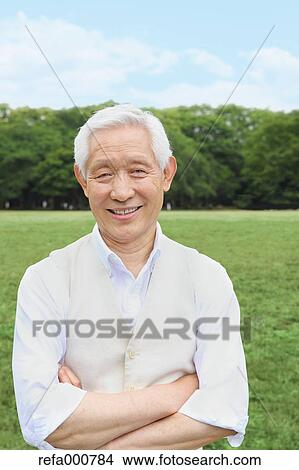 Senior adult Japanese man in a park View Large Photo Image Picture - Senior adult Japanese man in a park. Fotosearch
