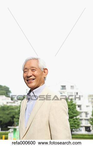 Senior adult Japanese man in a park View Large Photo Image Stock Image - Senior adult Japanese man in a park. Fotosearch