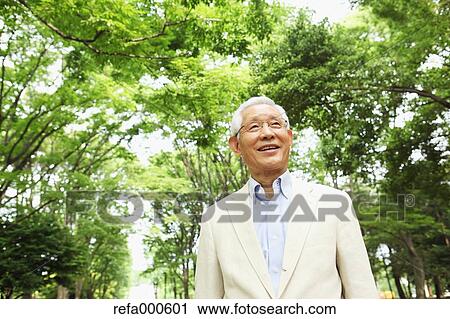 Senior adult Japanese man in a park View Large Photo Image Stock Image - Senior adult Japanese man in a park. Fotosearch