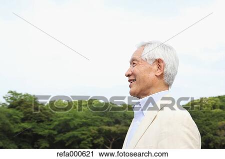 Senior adult Japanese man in a park View Large Photo Image Stock Image - Senior adult Japanese man in a park. Fotosearch