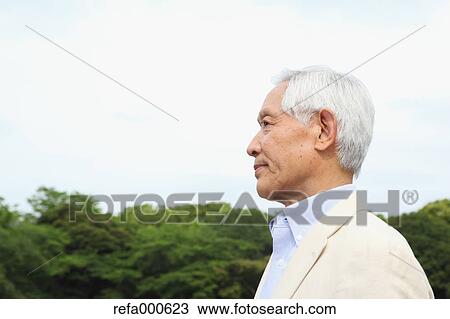 Senior adult Japanese man in a park View Large Photo Image Stock Image - Senior adult Japanese man in a park. Fotosearch