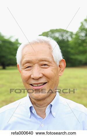 Senior adult Japanese man in a park View Large Photo Image Stock Image - Senior adult Japanese man in a park. Fotosearch