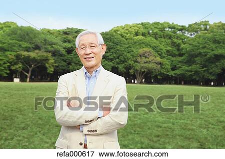 Stock Photo - Senior adult Japanese man in a park. Fotosearch