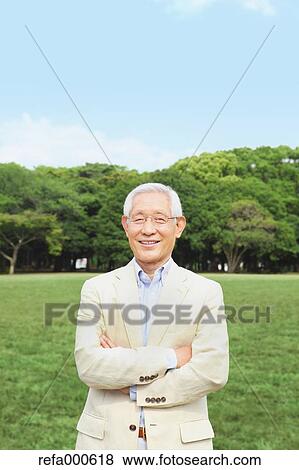 Senior adult Japanese man in a park View Large Photo Image Stock Photo - Senior adult Japanese man in a park. Fotosearch