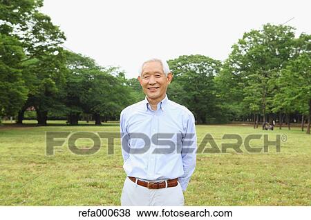Senior adult Japanese man in a park View Large Photo Image Stock Photo - Senior adult Japanese man in a park. Fotosearch