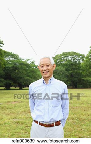 Stock Photo - Senior adult Japanese man in a park. Fotosearch