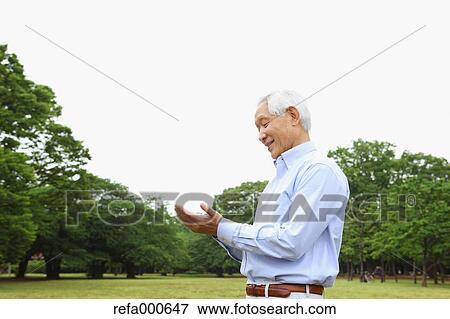 Senior adult Japanese man in a park View Large Photo Image Stock Photo - Senior adult Japanese man in a park. Fotosearch