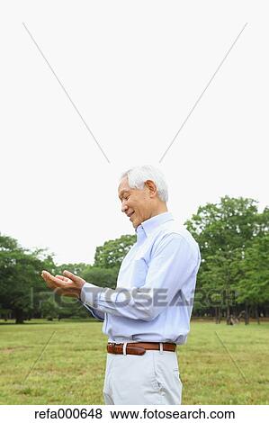 Senior adult Japanese man in a park View Large Photo Image Stock Photo - Senior adult Japanese man in a park. Fotosearch